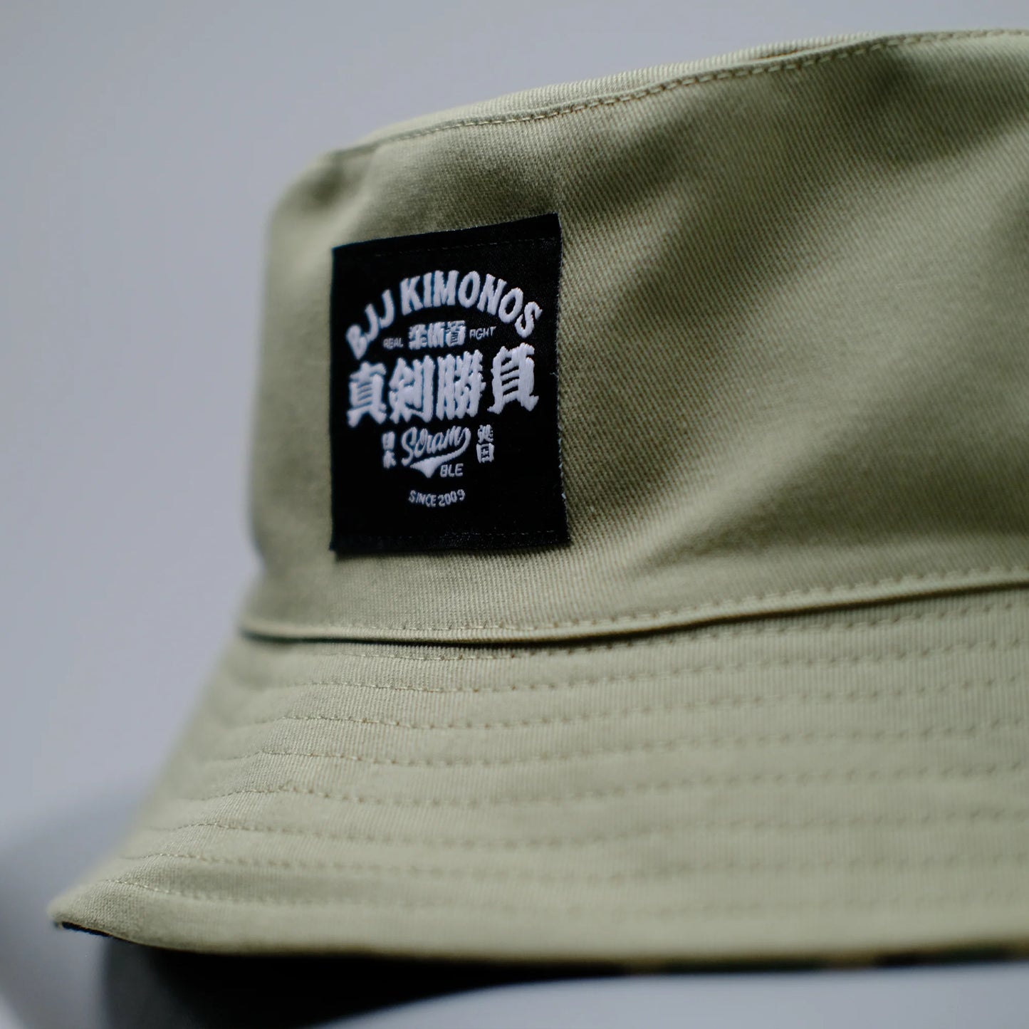 SCRAMBLE REVERSIBLE BUCKET HAT